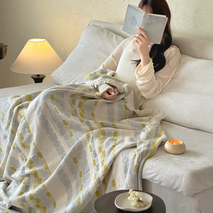 Generous cotton-linen throw blanket with geometric pattern and fringes