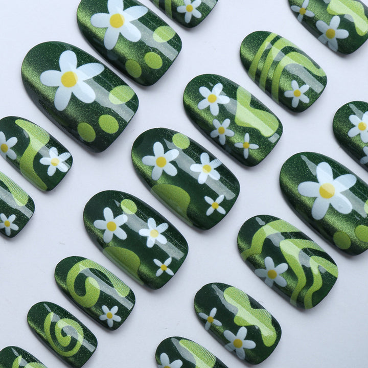 Artificial nails with floral and glittering accents Stornfield