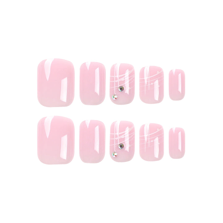 Artful nail extensions with elegant design and rhinestone embellishments Stornfield