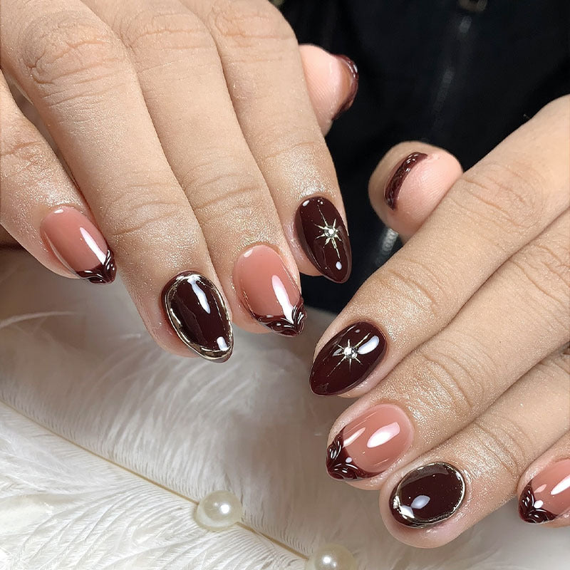 Acrylic nail set with elegant gradient and delicate embellishments Stornfield