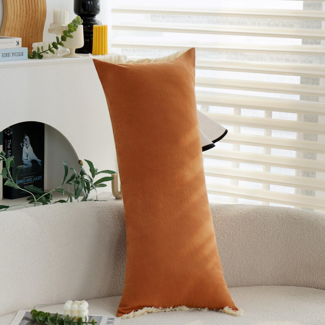 Elegant decorative cushion with fringe decoration