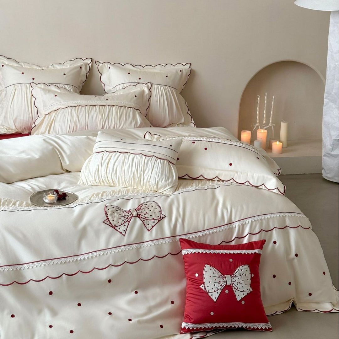 Elegant cotton satin bedding set with decorative bow appliqué and gathered frill