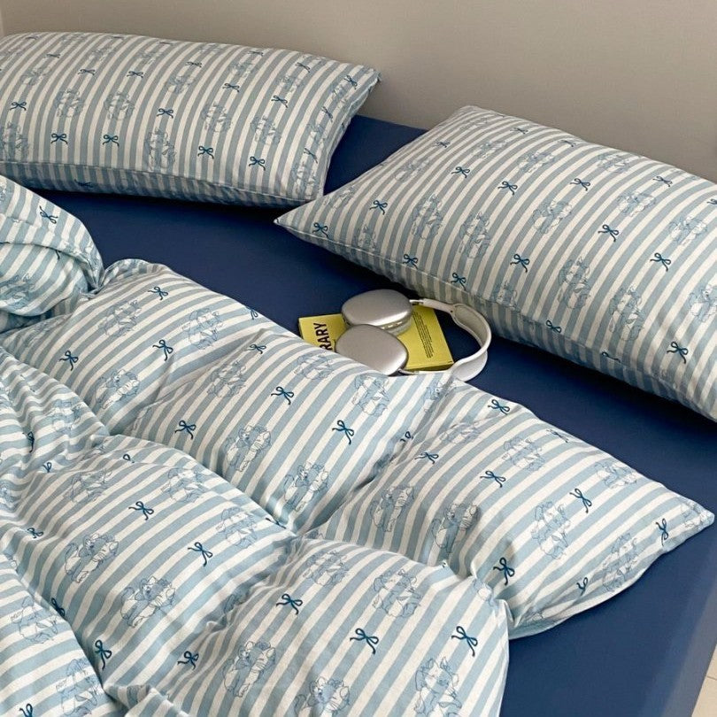 Light cotton bedding set with quilted topper and fine stripe pattern