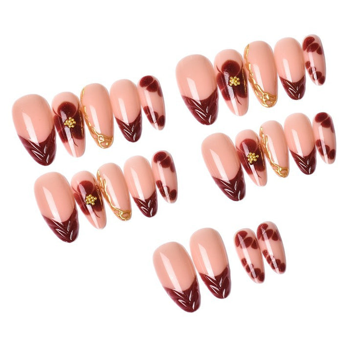 Exclusive artificial nails with floral designs and gold embellishments Stornfield