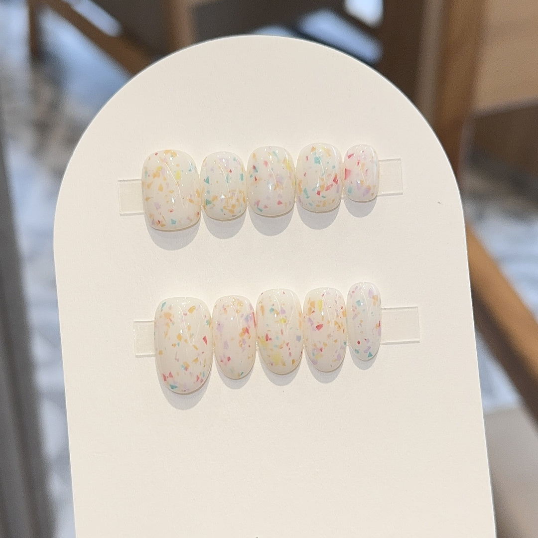 Artificial nails with cheerful sparkle design Stornfield