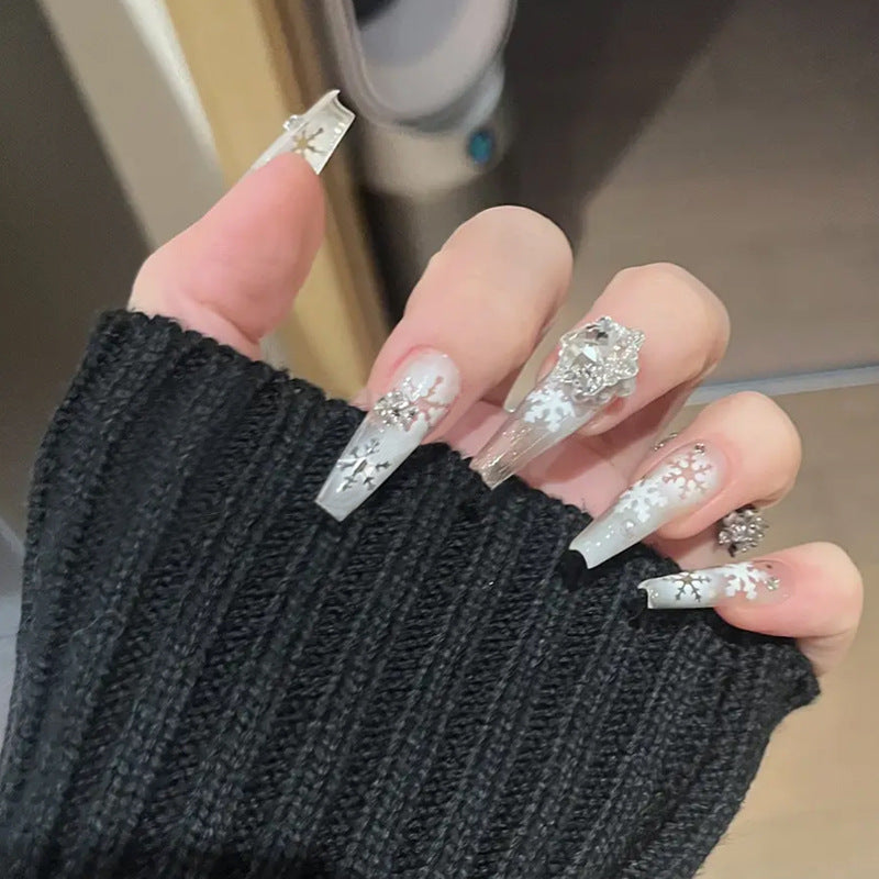 Artificial nail set with frosty snowflake design and sparkling 3D applications Stornfield