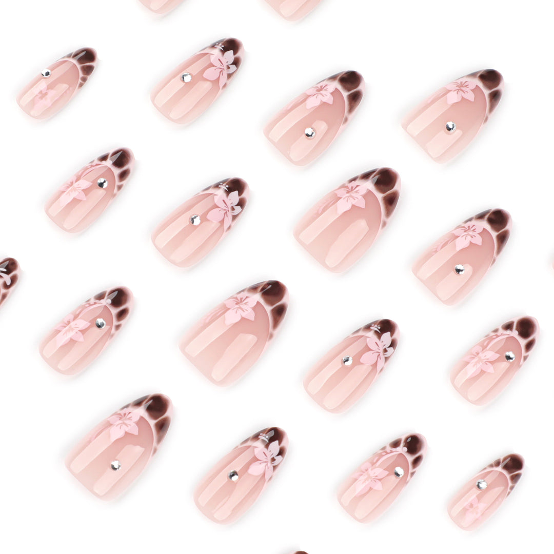 Elegant Artificial Nail Art with Floral Design and Glitter Accents Stornfield