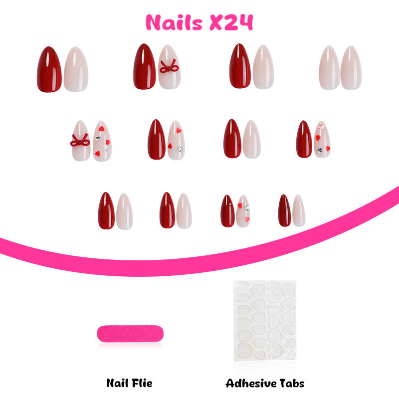 Artificial nail set with festive heart and bow accents Stornfield