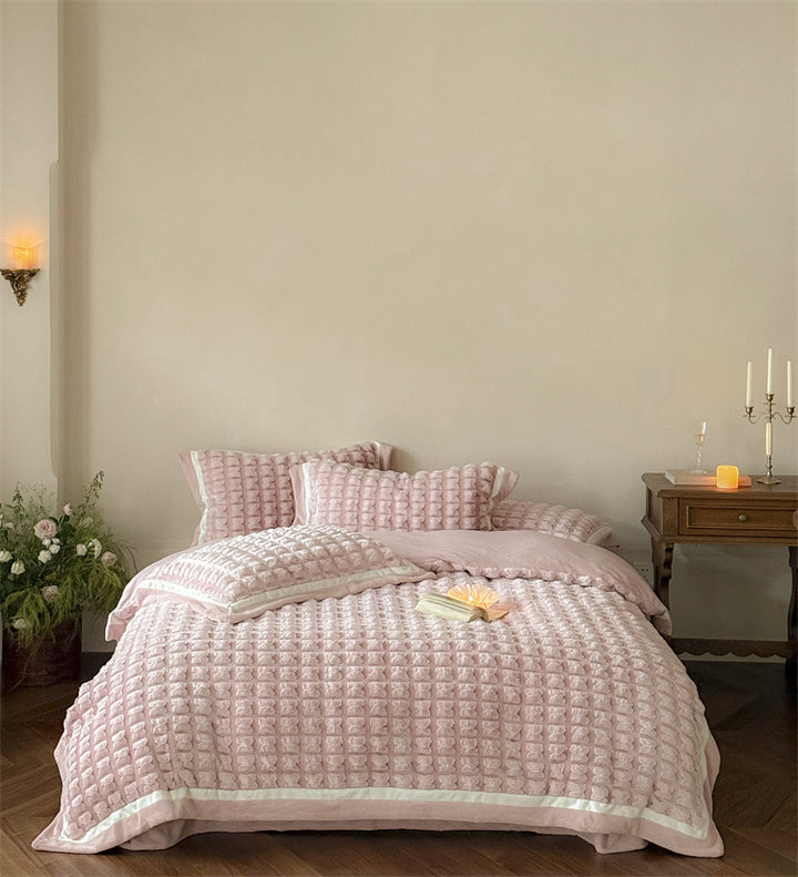 Quilted velvet bedding set with 3D waffle structure and decorative border Stornfield