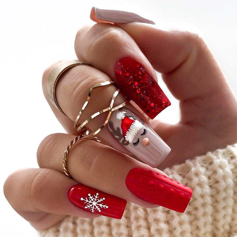 Artificial nail set with festive Christmas designs and glitter accents Stornfield