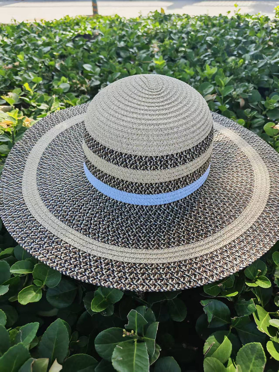 Elegant sun hat with wide brim and subtle stripe pattern Stornfield