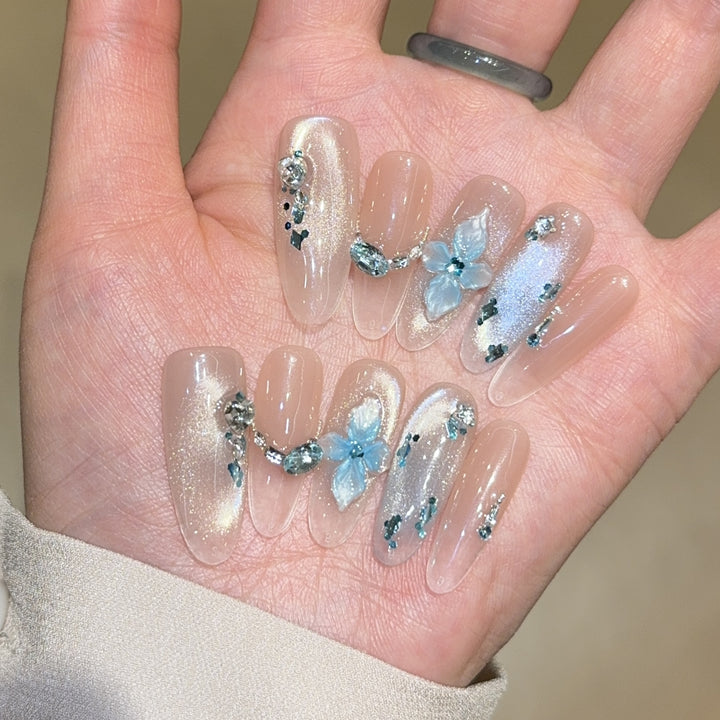 Artificial nails with unique floral design and glitter accents Stornfield