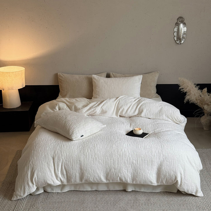 Structured linen-cotton bedding set with embossed relief quilting and extra soft feel
