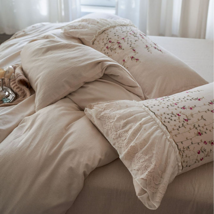 Vintage-inspired ruffled blanket and pillow set made of cotton muslin with delicate floral embroidery