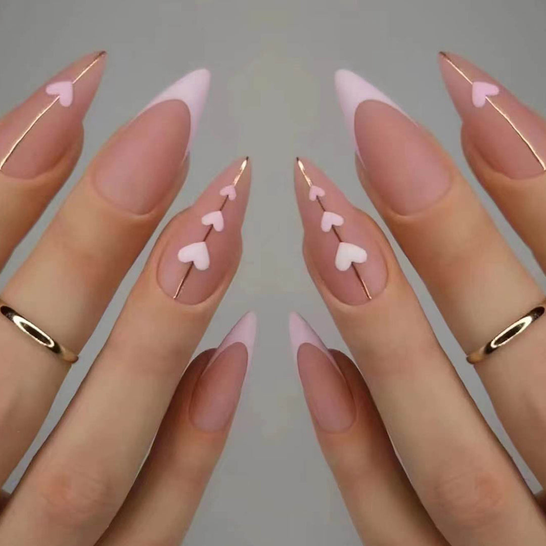 Artful stiletto nails with heart-shaped accents Stornfield