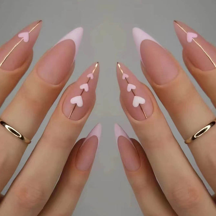 Artful stiletto nails with heart-shaped accents Stornfield