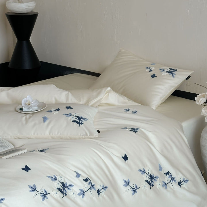 Luxurious satin bedding set with blue flower embroidery