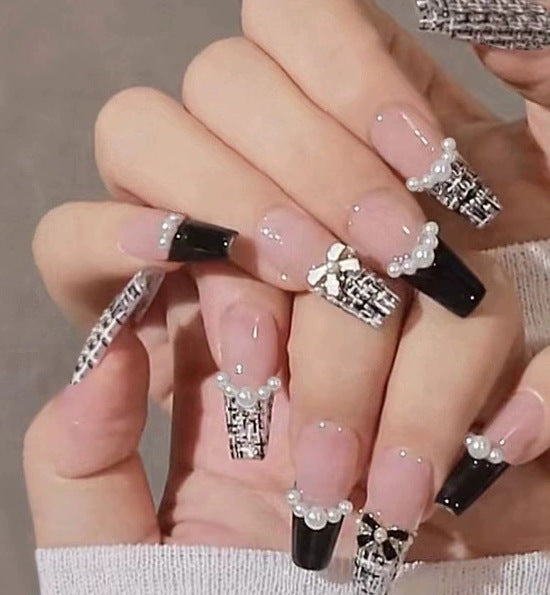 Elegant nail design with pearl embellishment Stornfield