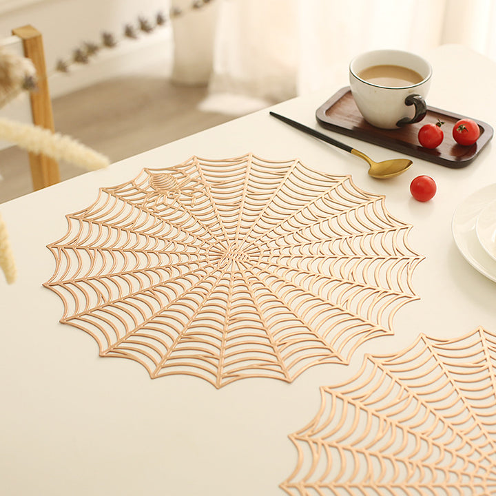 Round filigree spider web placemat made of heat- and water-repellent PVC for table decoration
