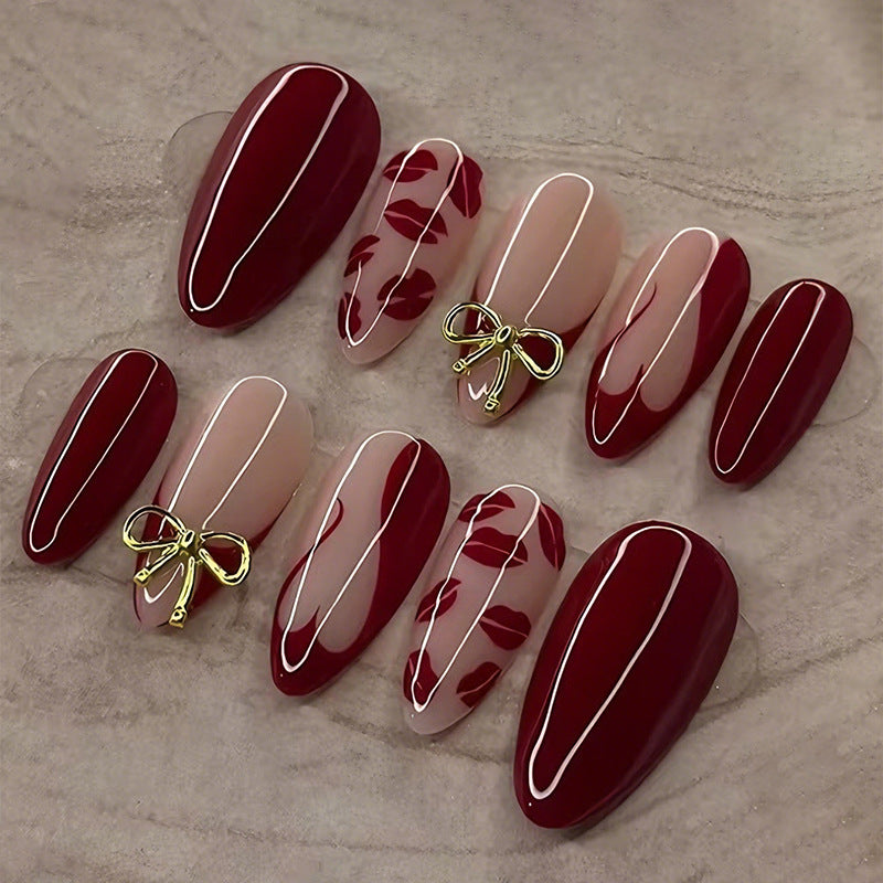 Artificial nail set with elegant bow and kiss mouth designs Stornfield