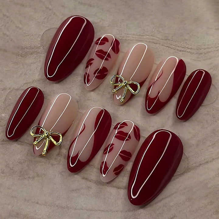 Artificial nail set with elegant bow and kiss mouth designs Stornfield