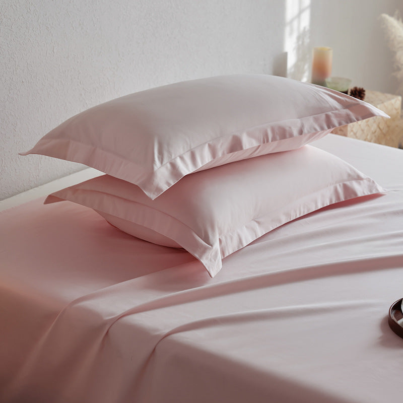 Premium pillowcase and fitted sheet set made of cotton percale with hotel edge