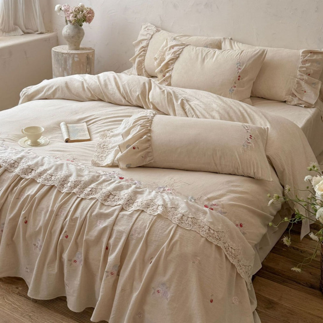 Country house style complete bedding set with voluminous bed skirt, lace trim, and fine floral embroidery