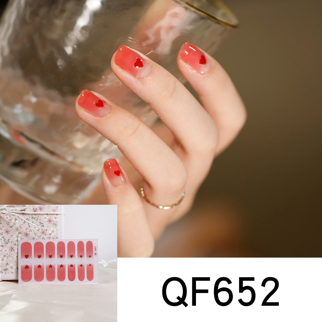 Artificial nail art with heart-shaped designs and soft color gradients Stornfield