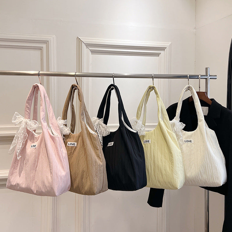 Leisure bag with structured design and playful scarf Stornfield