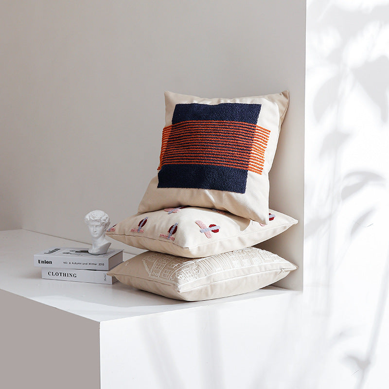 Square cushion cover with hand-tufted geometric applications