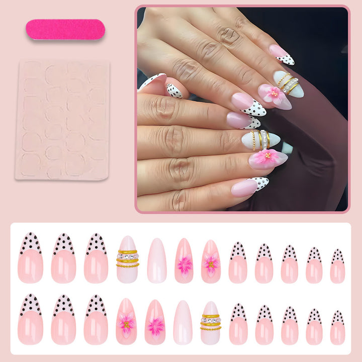 Acrylic nail set with romantic floral patterns and elegant glitter decorations Stornfield