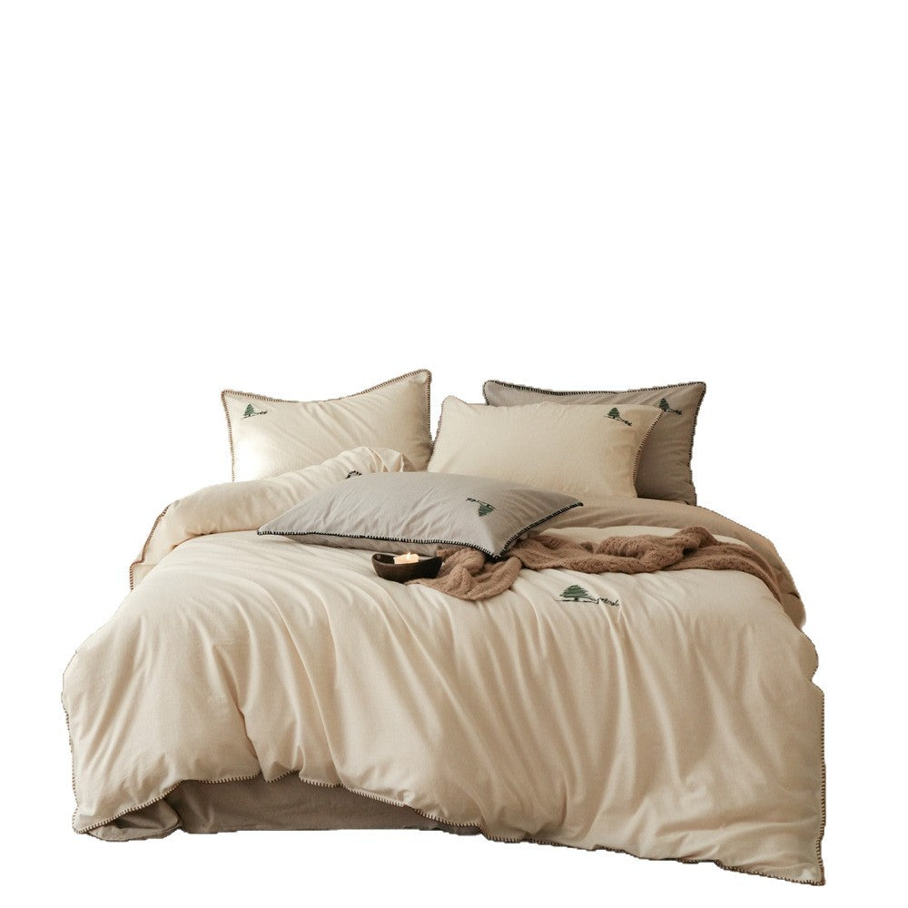 Bedding set made of cotton satin with fine embroidery and contrasting hem