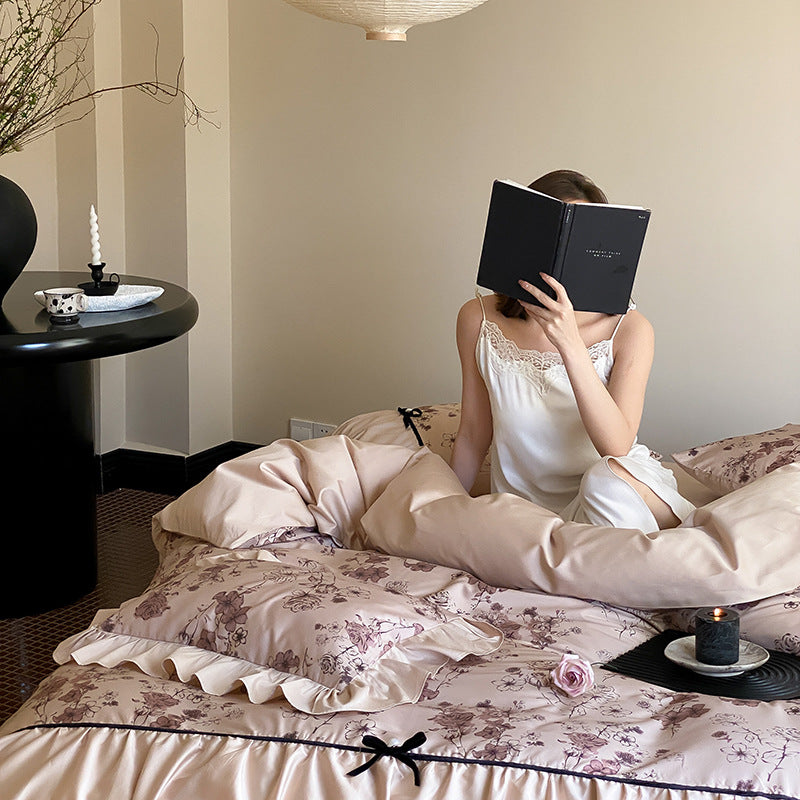 Luxurious satin bedding set with floral print and ruffles