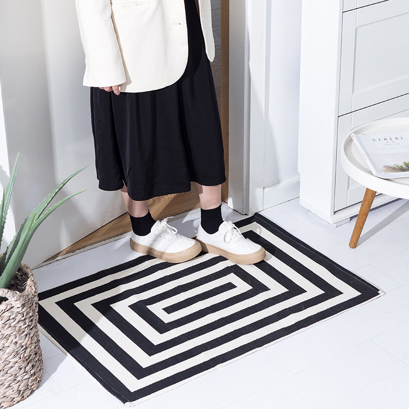 Robust flat-woven doormat for entrance area with check pattern and anti-slip back