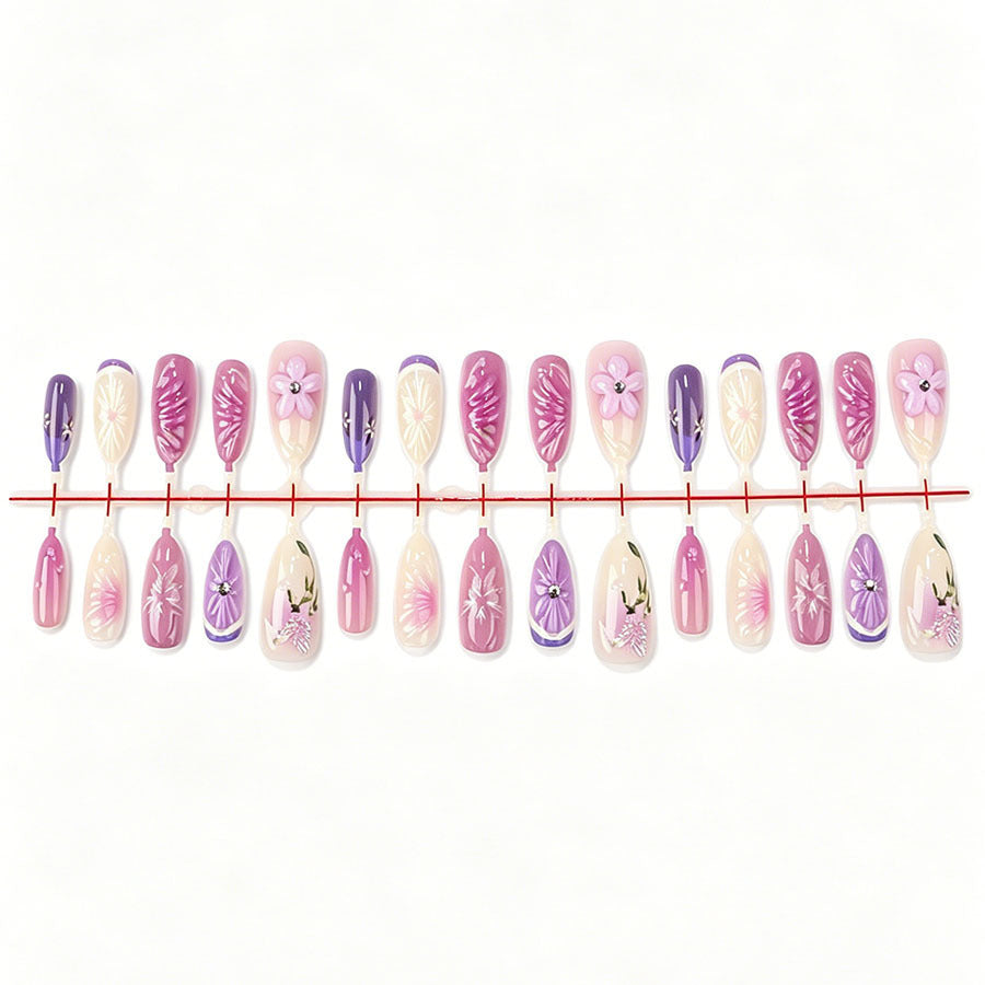 Decorative artificial nails with floral designs and glitter accents Stornfield