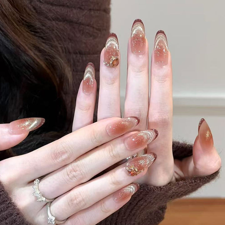 Glamorous art nails with glitter and stone accents Stornfield