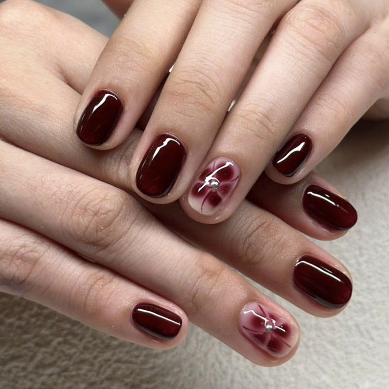 Elegant Nail Art with Glitter and Flower Elements Stornfield