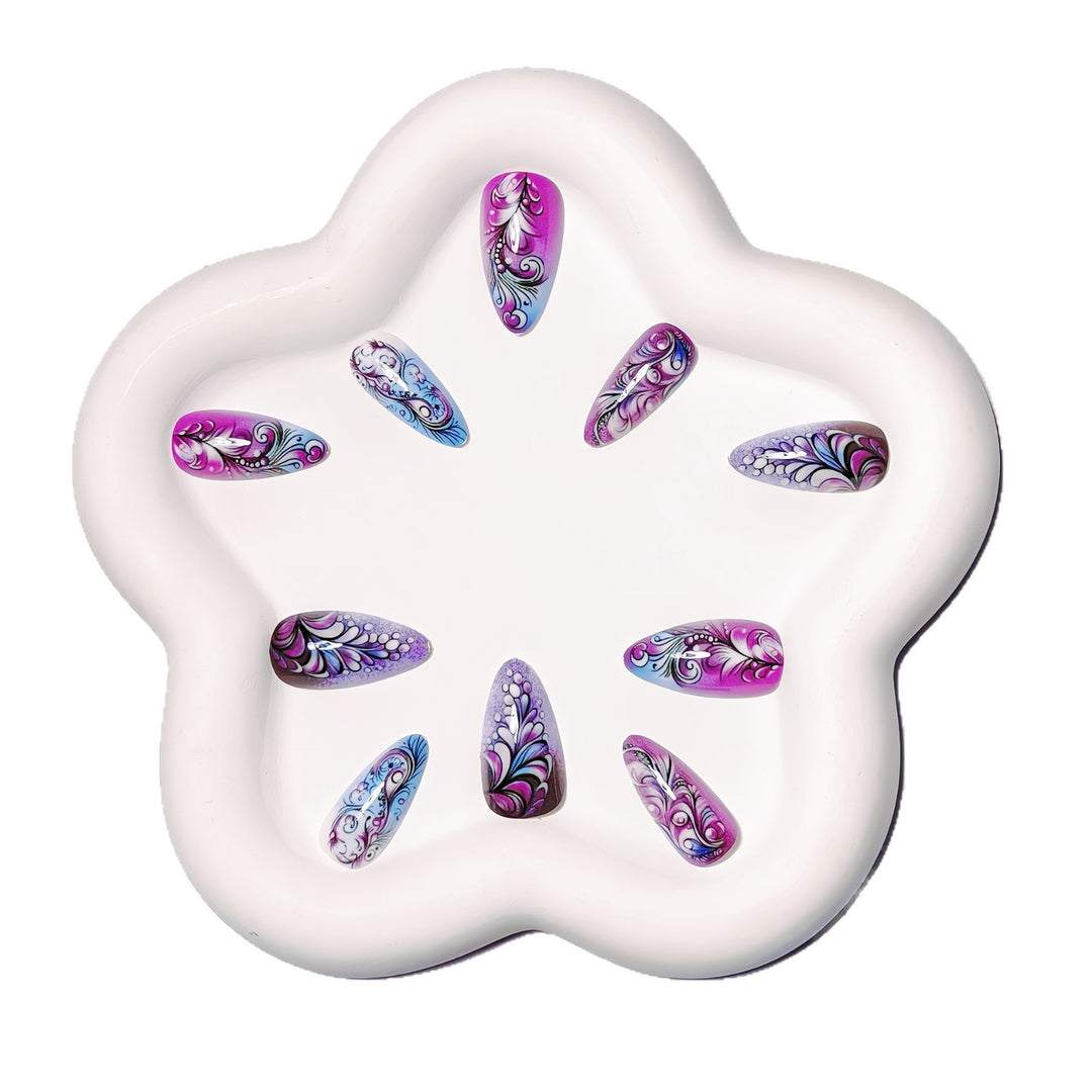 Creative artificial nails with floral and shimmering design elements Stornfield