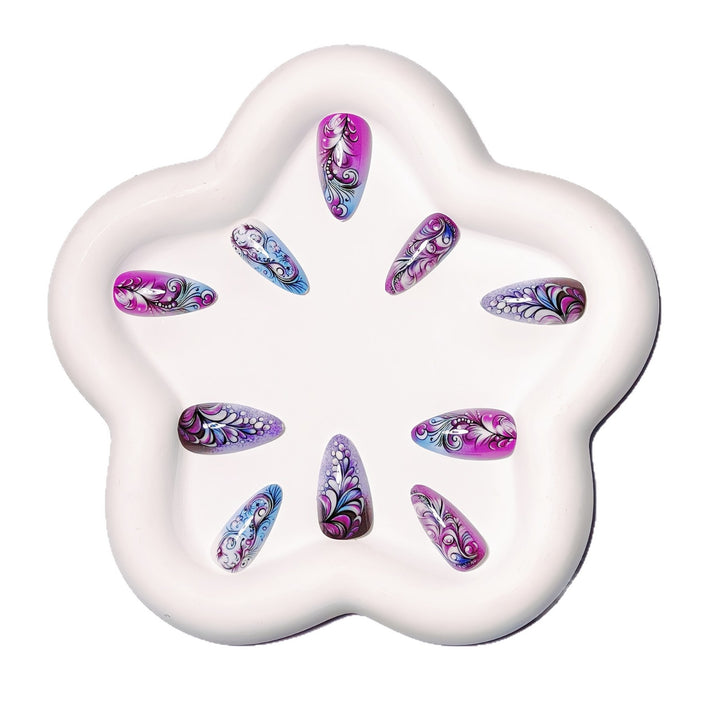 Creative artificial nails with floral and shimmering design elements Stornfield