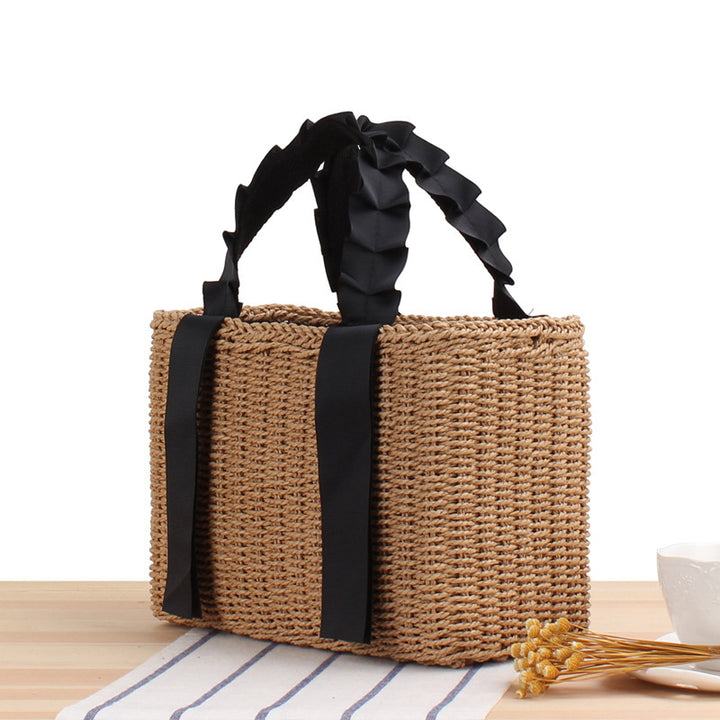 Playful basket bag with elegant fabric handle Stornfield