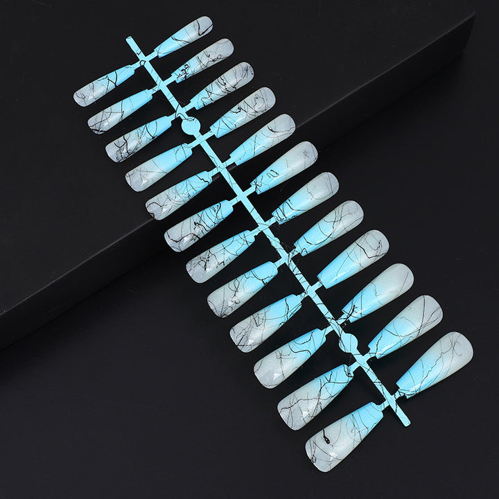 Artificial nails in modern ombre design with marbled accents Stornfield