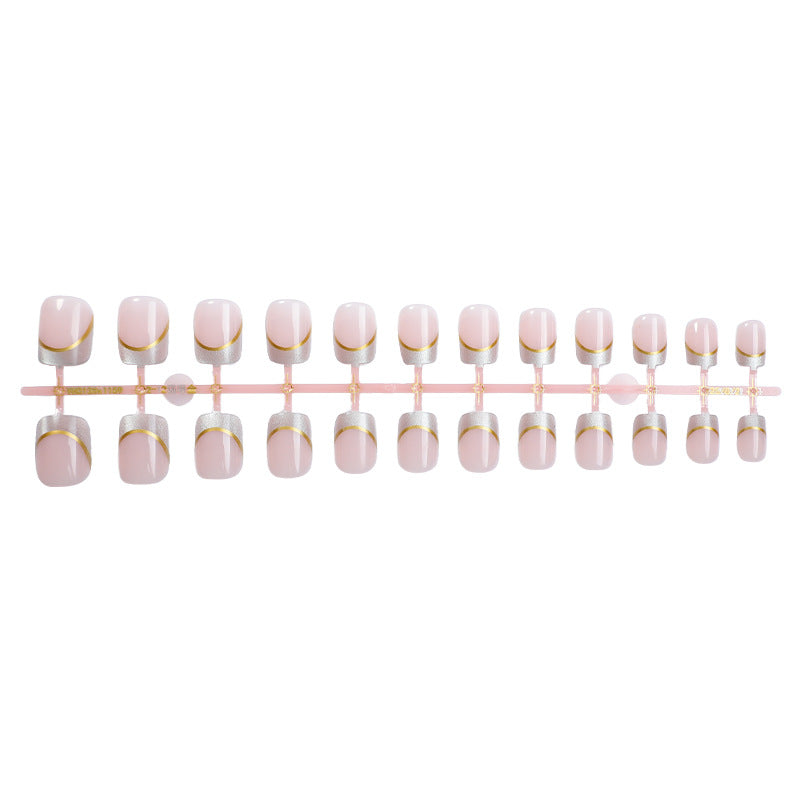 Artificial nail creations with elegant gold trim Stornfield