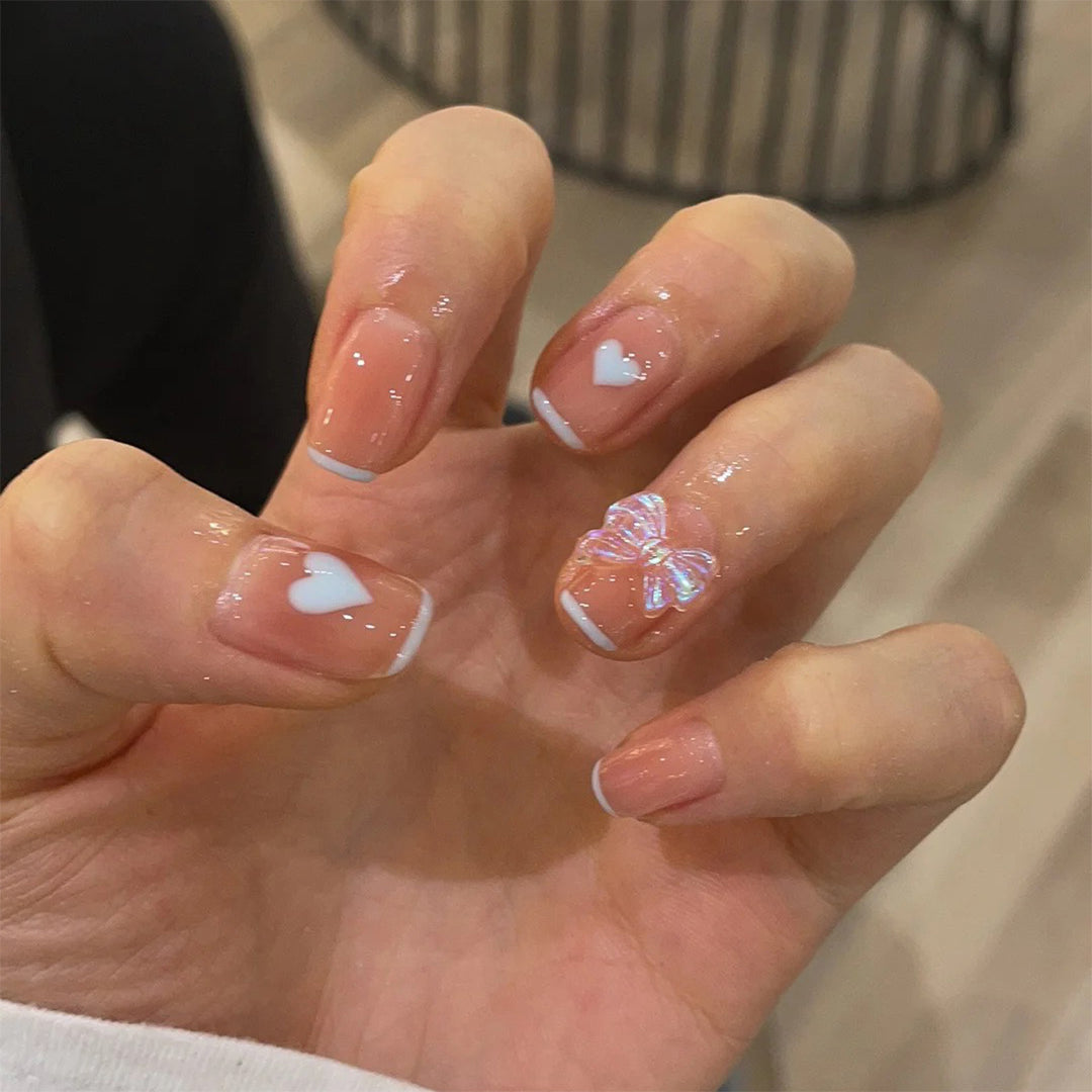 Nail art with heart and butterfly motifs Stornfield