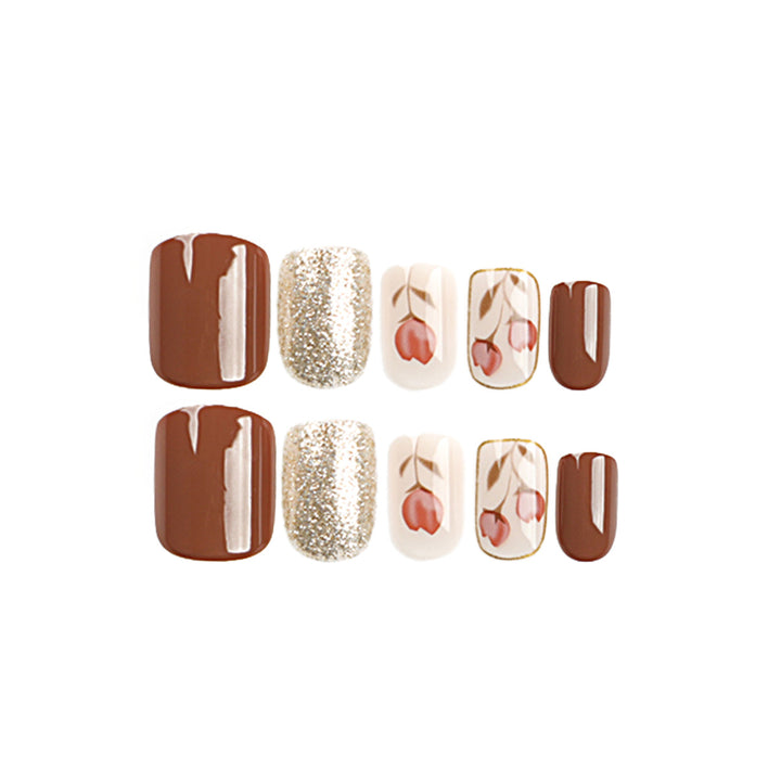 Artificial nail art with colorful flower design and glitter accents Stornfield