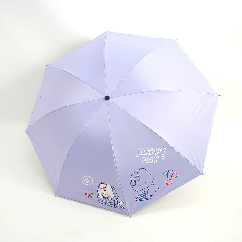 Ladies folding umbrella with playful design and cheerful Stornfield motif