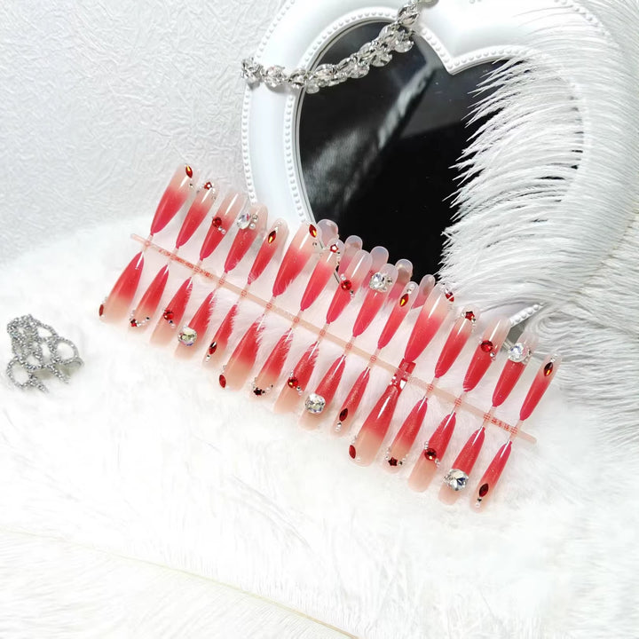 Glamorous artificial nails with sparkling ombre effect and elegant embellishments Stornfield