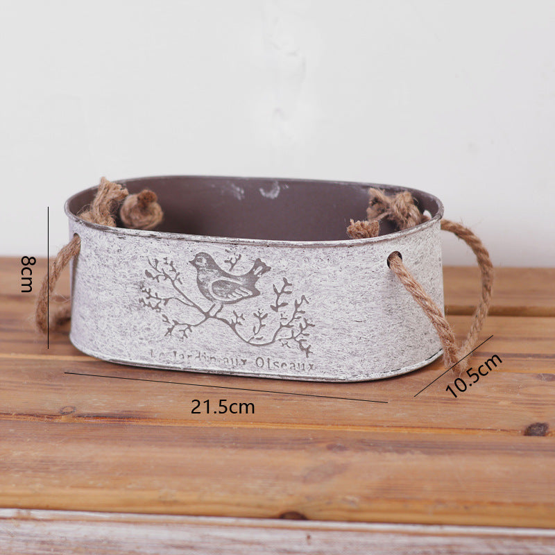Decorative storage basket made of metal with natural design Stornfield
