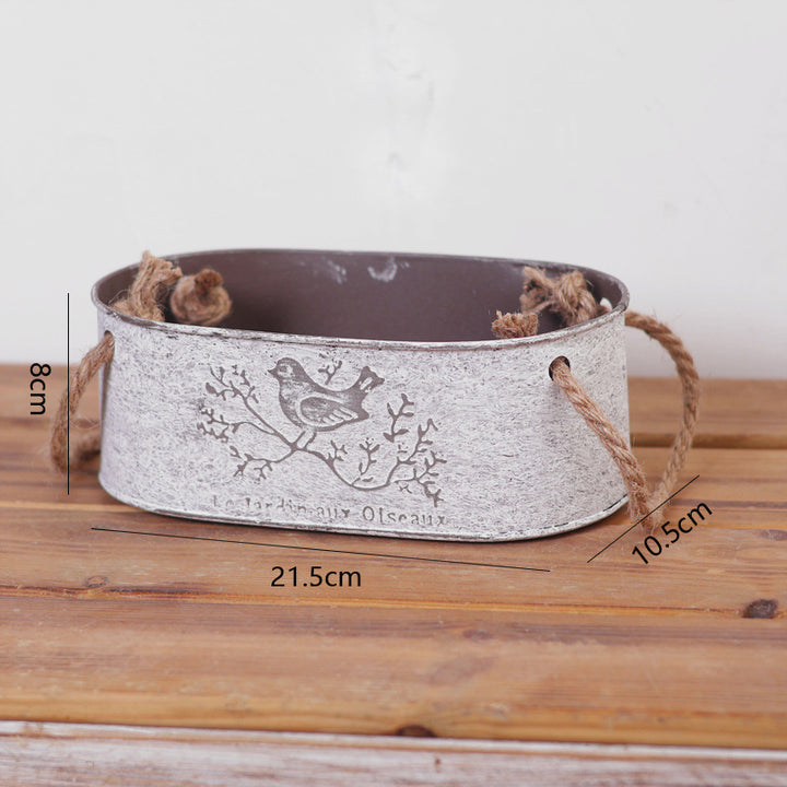 Decorative storage basket made of metal with natural design Stornfield