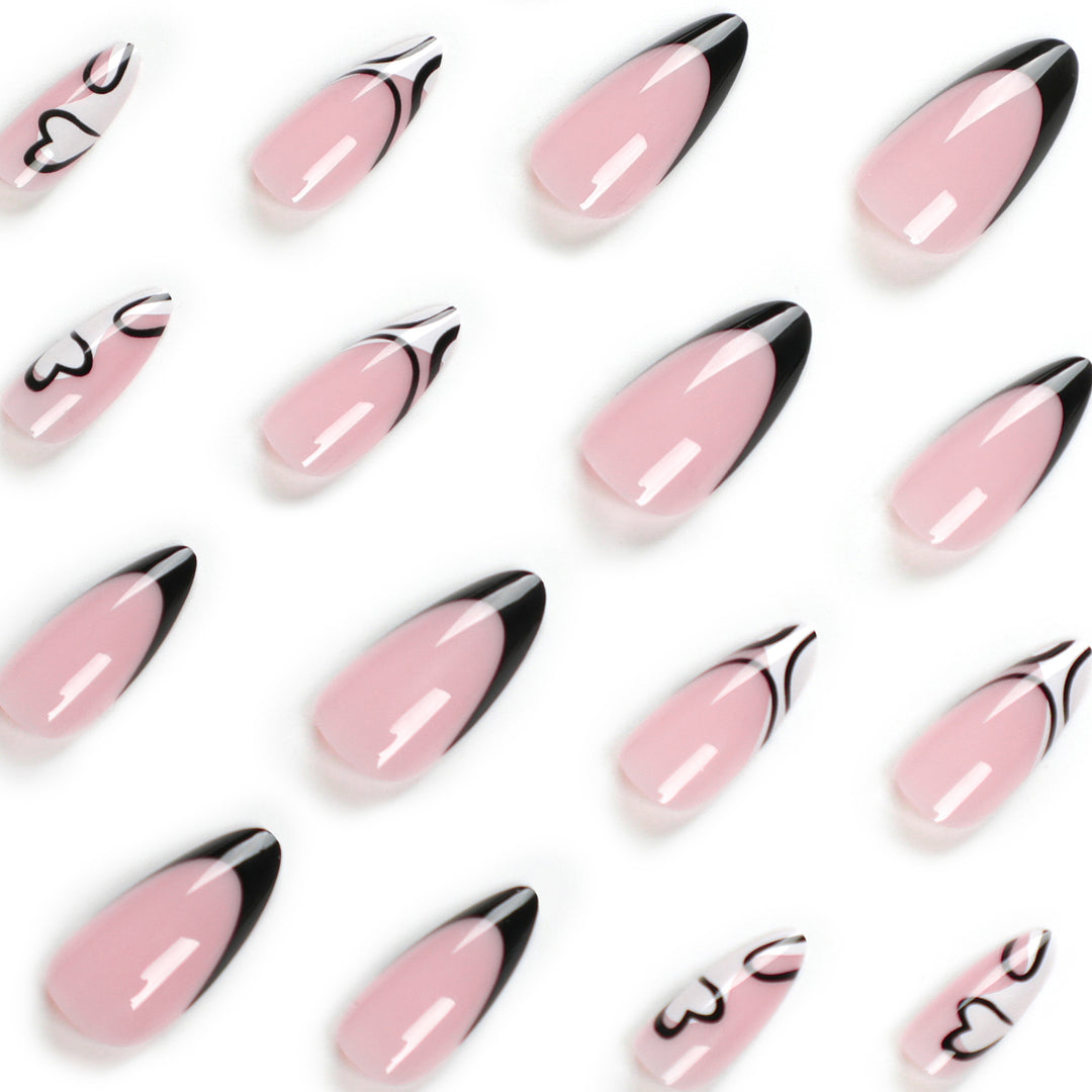 Artful stiletto nails with elegant black-and-white design Stornfield
