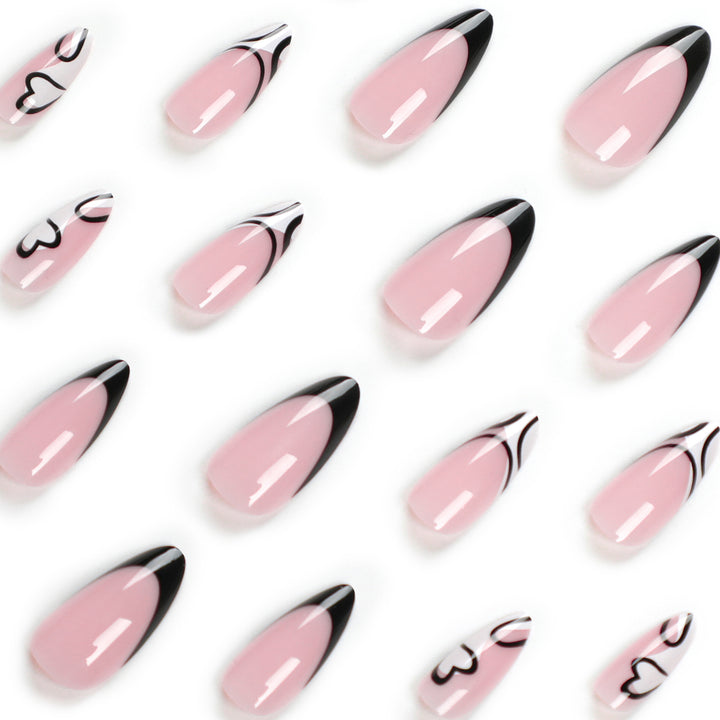Artful stiletto nails with elegant black-and-white design Stornfield